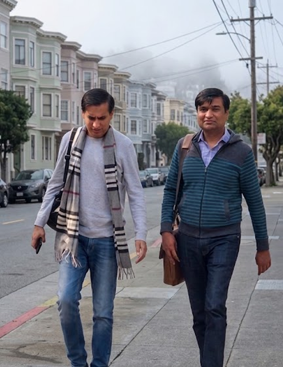 Naveen and Neeraj Gupta walking together on a San Francisco street